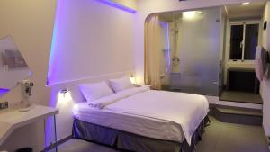 Postel nebo postele na pokoji v ubytování Galaxia Business Hotel