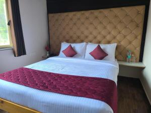 Postel nebo postele na pokoji v ubytování Auro Wellness Castle