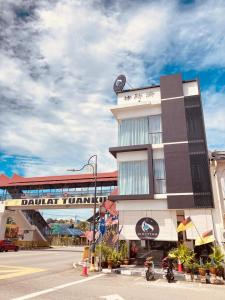 a building with a clock on top of it at CS Junction Point - Special Day Room SDR in Kuala Pilah +8 photos