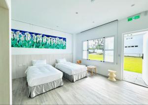 Postel nebo postele na pokoji v ubytování 雲瀑春日民宿Springday