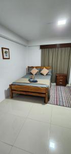 a bedroom with a bed in a room at Hill Bottom Accommodation Flat 2 in Suva