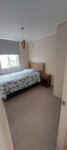 Postel nebo postele na pokoji v ubytování Arriendo departamento Villarrica