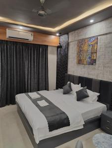 a bedroom with a large bed in a room at Nestle Luxury Homes 1 in Lucknow