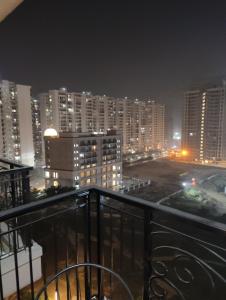 a view of a city at night with buildings at Nestle Luxury Homes 1 in Lucknow