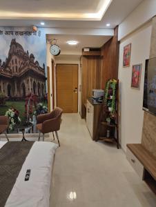 a corridor of a room with a bed and a kitchen at Nestle Luxury Homes 1 in Lucknow +18 photos