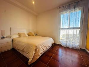 a bedroom with a bed and a large window at Casa en la Playa Alcossebre La Creueta in Alcossebre +36 photos