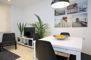 Televízia a/alebo spoločenská miestnosť v ubytovaní Poeta Llombart Apartment