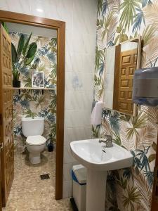 a bathroom with a sink and a toilet at El Refugio Valdelinares Gastro Hostal in Valdelinares