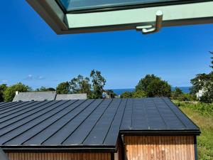 a metal roof on top of a building at Rhun Even, charmante maison bretonne pour 6 personnes in Plougasnou
