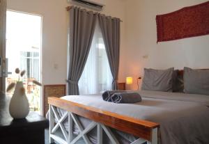 Postel nebo postele na pokoji v ubytování Tipsea Turtle Rooftop Hostel Gili Trawangan