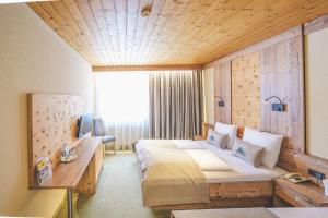 En eller flere senger på et rom på Hotel Styrolerhof