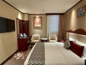 Televiisor ja/või meelelahutuskeskus majutusasutuses Macau Masters Hotel