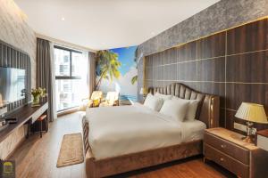 Giường trong phòng chung tại Apec Mandala Cham Bay Mui Ne Condotel RS +59 ảnh