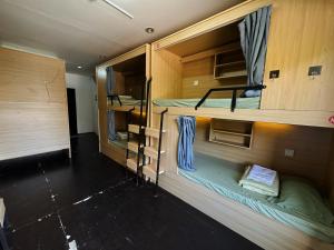 an overhead view of a room with two bunk beds at Truman Hostel in Luang Prabang