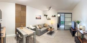a living room with a couch and a table at Brunnen in Bremerhaven