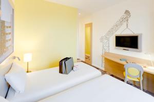 Postel nebo postele na pokoji v ubytování ibis Styles Glasgow Centre George Square