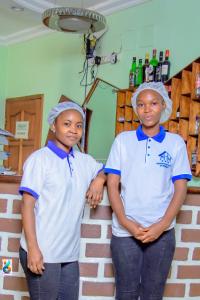 two young boys standing next to each other at RESIDENCE HOTEL Moungali in Brazzaville