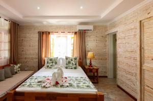 Ένα ή περισσότερα κρεβάτια σε δωμάτιο στο Ambiance Villa