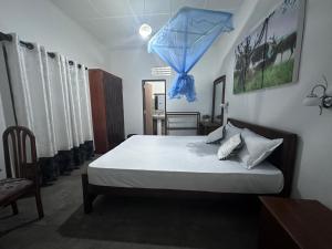 Ένα ή περισσότερα κρεβάτια σε δωμάτιο στο Sunny Surf Villa