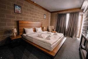 Voodi või voodid majutusasutuse Alpine Lounge Boutique Hotel toas