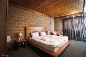 Voodi või voodid majutusasutuse Alpine Lounge Boutique Hotel toas