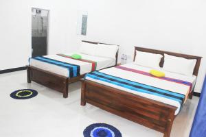 Letto o letti in una camera di Sigiriya Mana B&B
