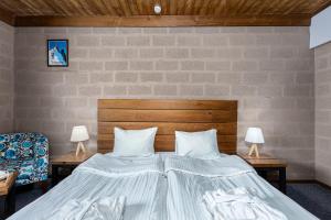 Voodi või voodid majutusasutuse Alpine Lounge Boutique Hotel toas