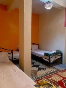Voodi või voodid majutusasutuse Dar Relax Hostel, Gorges de Todra toas