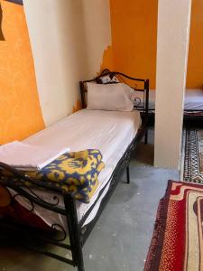 Voodi või voodid majutusasutuse Dar Relax Hostel, Gorges de Todra toas