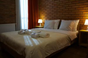 Postel nebo postele na pokoji v ubytování Hotel Mogzauri