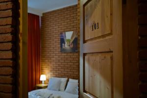 Postel nebo postele na pokoji v ubytování Hotel Mogzauri