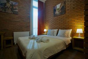 Postel nebo postele na pokoji v ubytování Hotel Mogzauri