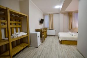 Postel nebo postele na pokoji v ubytování Hotel Mogzauri