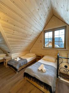 Postel nebo postele na pokoji v ubytování Śwarna Kolibecka