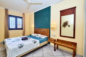 Ένα ή περισσότερα κρεβάτια σε δωμάτιο στο Tropical African Vibe +17 φωτογραφίες