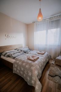 Postel nebo postele na pokoji v ubytování Viva Apartman