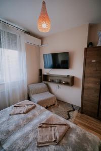 Postel nebo postele na pokoji v ubytování Viva Apartman
