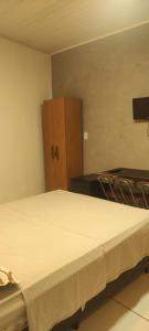 Ένα ή περισσότερα κρεβάτια σε δωμάτιο στο Suíte Maria bonita