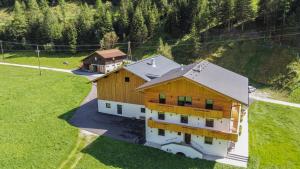 an aerial view of a home with a house at Nedererhof - Ferienwohnung Hoamat in Schmirn
