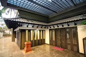 a building with a skylight above the doors at starhive homestay in Kalpetta
