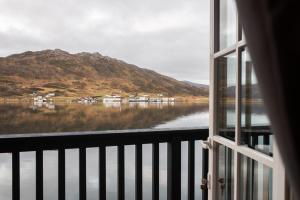 a view of a lake from a window at Amberfish in Tromsø +9 photos