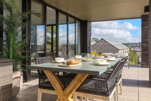 a table with food on it on a balcony at 14 An Garth in Hayle