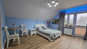 Posteľ alebo postele v izbe v ubytovaní Woodland - Apartments & SPA Łagów