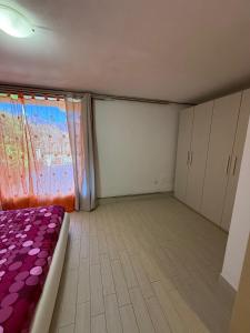 Postel nebo postele na pokoji v ubytování Villetta Ulivi CA7 sun terrace by Gardadomusmea