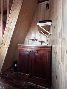 a room with a wooden cabin with a sink in it at Country Villa MMMM-2-CampScepanovic in Mojkovac
