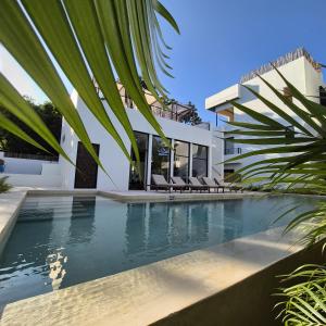 an external view of a villa with a swimming pool at New luxury studio with plunge pool in Tulum