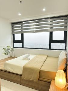 Ένα ή περισσότερα κρεβάτια σε δωμάτιο στο Hue Charm Apartment with Pool and Gym
