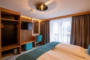 Posteľ alebo postele v izbe v ubytovaní Hotel Garni Subretta