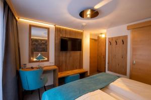 Posteľ alebo postele v izbe v ubytovaní Hotel Garni Subretta