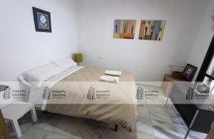 Cama o camas de una habitación en Pueblo Del Parque 2 - Soleada terraza con jardín - Piscina y Playa